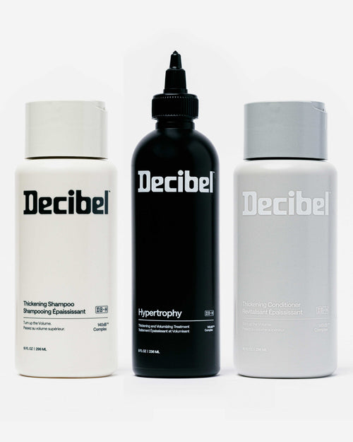 Decibel Thickening Shampoo, Hypertrophy Thickening and Volumizing Treatment, and Thickening Conditioner bottles displayed together on a white background.
