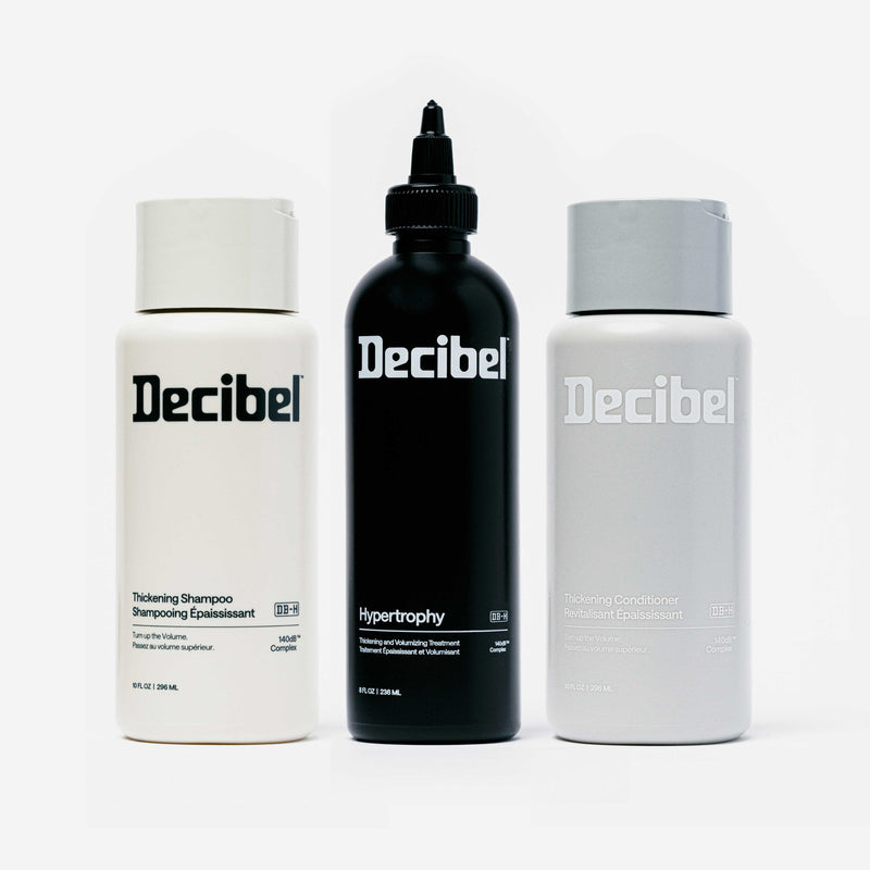 Decibel Thickening Shampoo, Hypertrophy Thickening and Volumizing Treatment, and Thickening Conditioner bottles displayed together on a white background.
