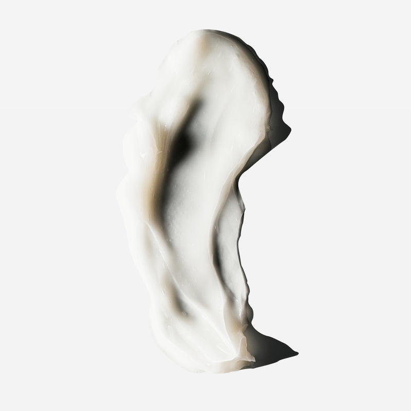 Creamy swatch of Decibelhair thickening conditioner swirled on a white background.
