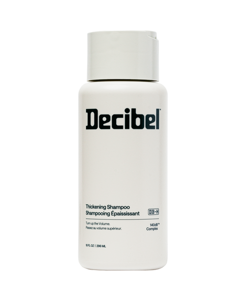 Decibel Thickening Shampoo bottle, 10 fl oz, with 140dB Complex on cream packaging.