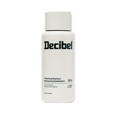 Decibel Thickening Shampoo bottle, 10 fl oz, with 140dB Complex on cream packaging.