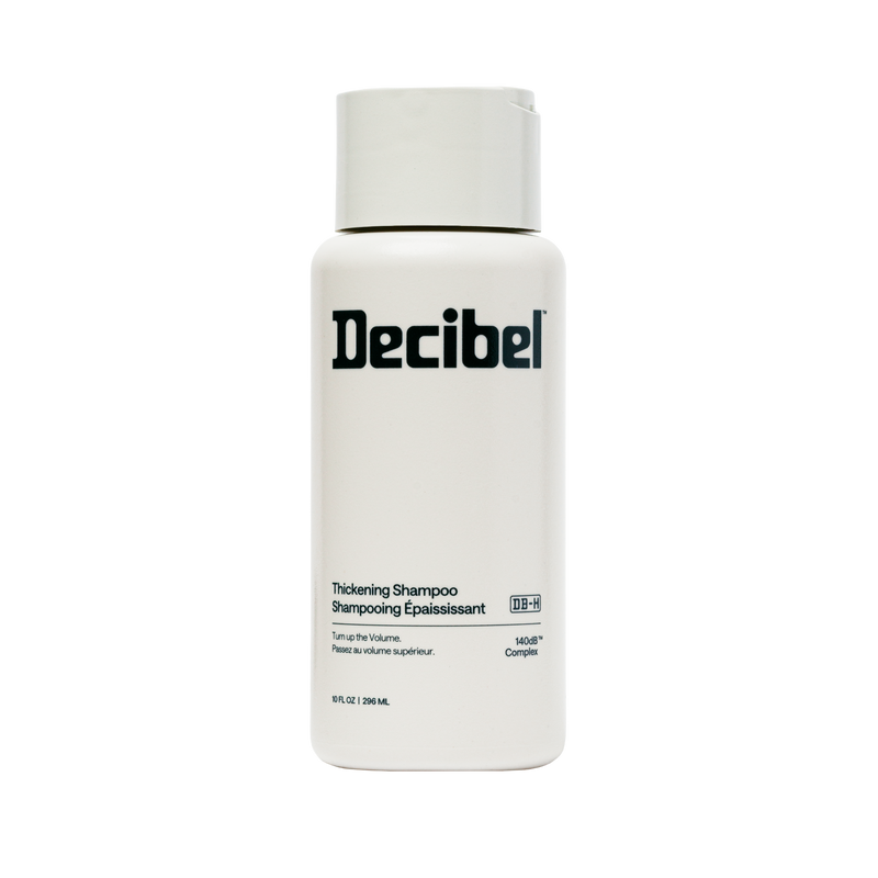 Decibel Thickening Shampoo bottle, 10 fl oz, with 140dB Complex on cream packaging.