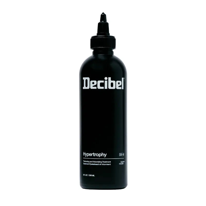 Decibel Hypertrophy thickening and volumizing treatment black bottle on a white background.